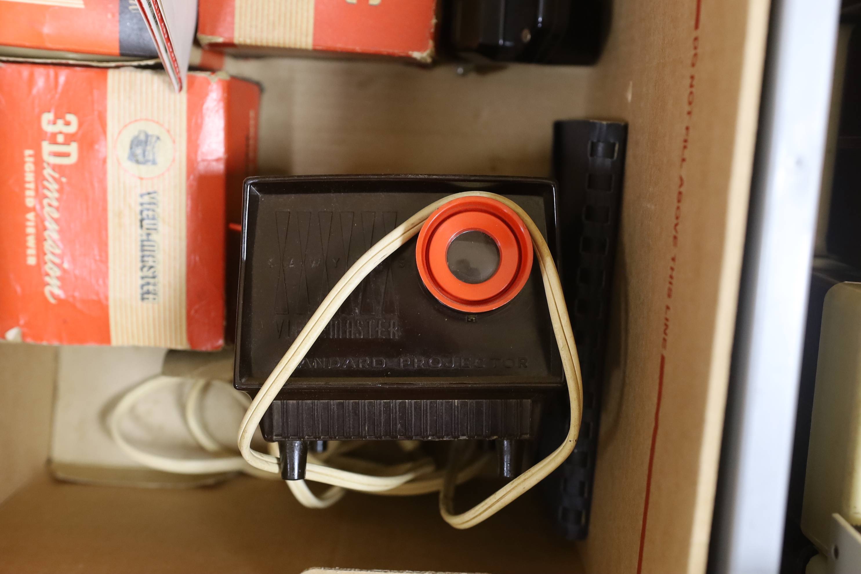 Three View-Master projectors and four View-Master viewers, together with eight View-Master plastic boxes containing a large quantity of reels with subjects including views of the United States, National Parks, Italy, Ger